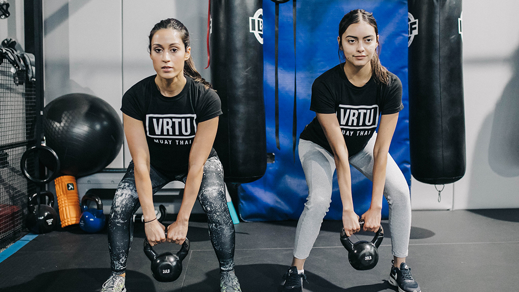 two girls doing exercise in VRTU gym