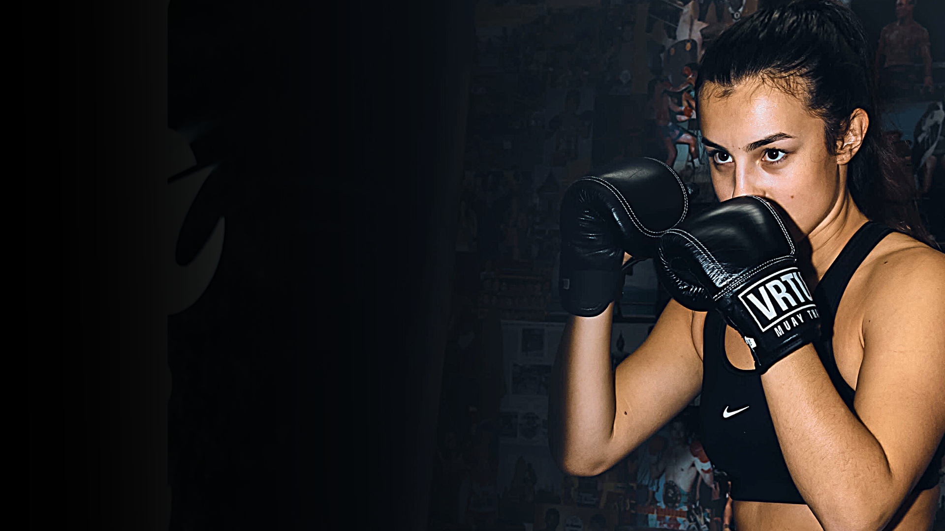 A girl boxing in VRTU gym wearing VRTU boxing gloves