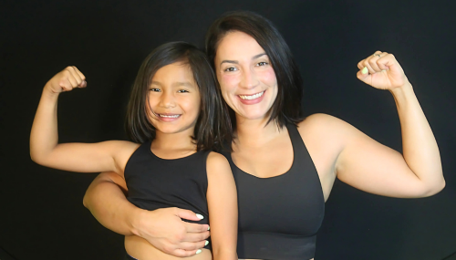 Mom and daughter in fitness class in Toronto